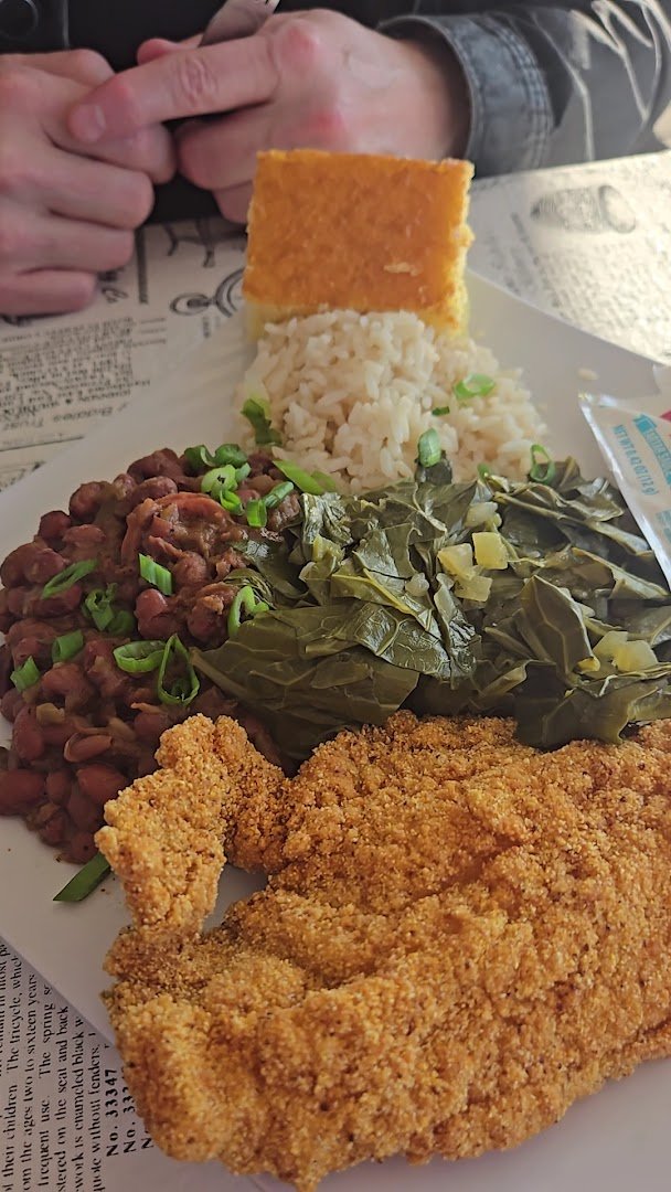 Seafood and barbecue plates on a restaurant table.